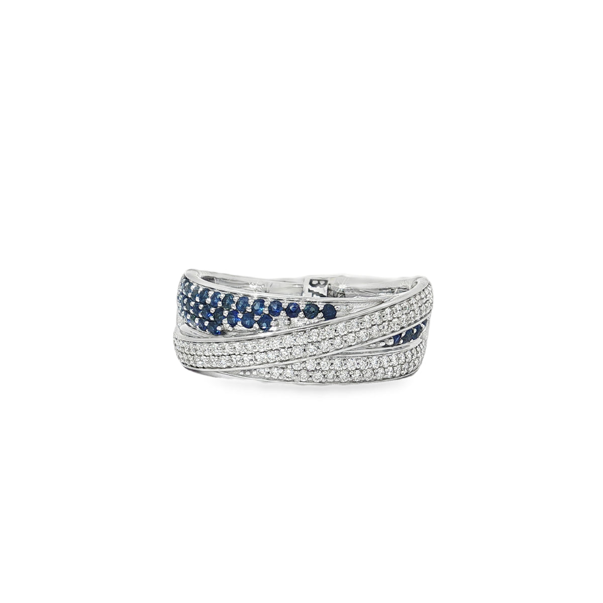White gold layered ribbon ring with sapphire rows between sweeping diamond-set bands