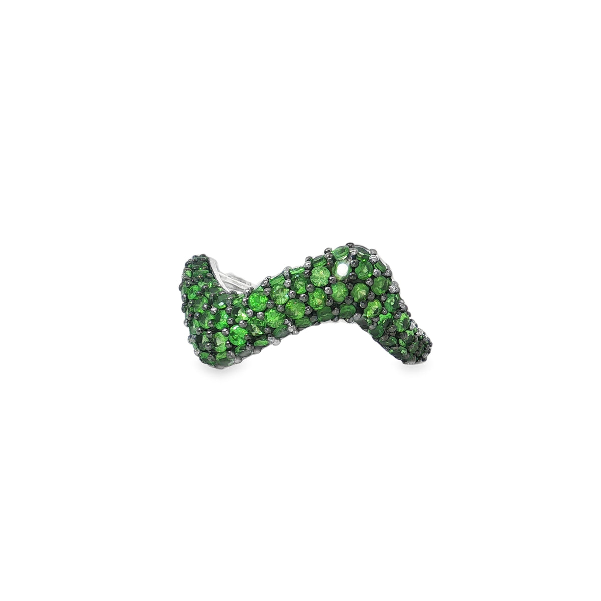 White gold ring with a broad wavy front covered in green tsavorite pavé