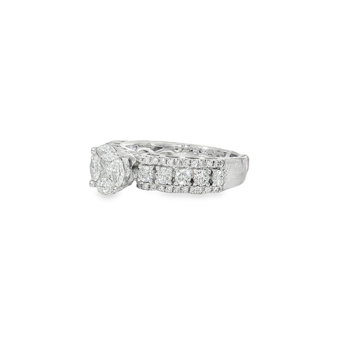 Angled view of diamond cluster ring showing raised centre and layered diamond shoulders