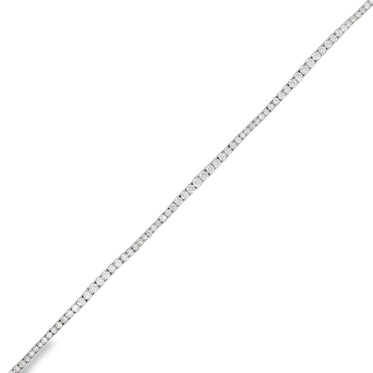 White gold round diamond tennis bracelet shown as a straight diagonal line