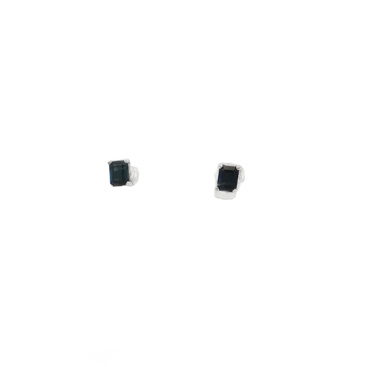 White gold stud earrings with rectangular blue sapphires held by corner prongs