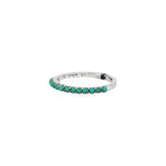 Angled view of turquoise stone row ring showing smooth white gold rear band