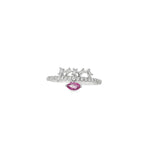 White gold ring with marquise-shaped pink sapphire and angled baguette diamond crown