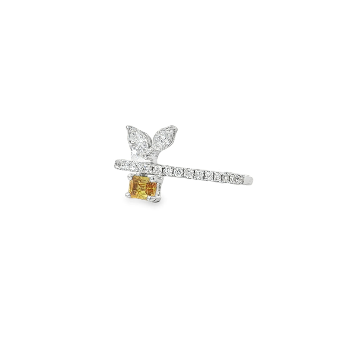 Angled view of square orange sapphire ring showing marquise leaves and round diamond band