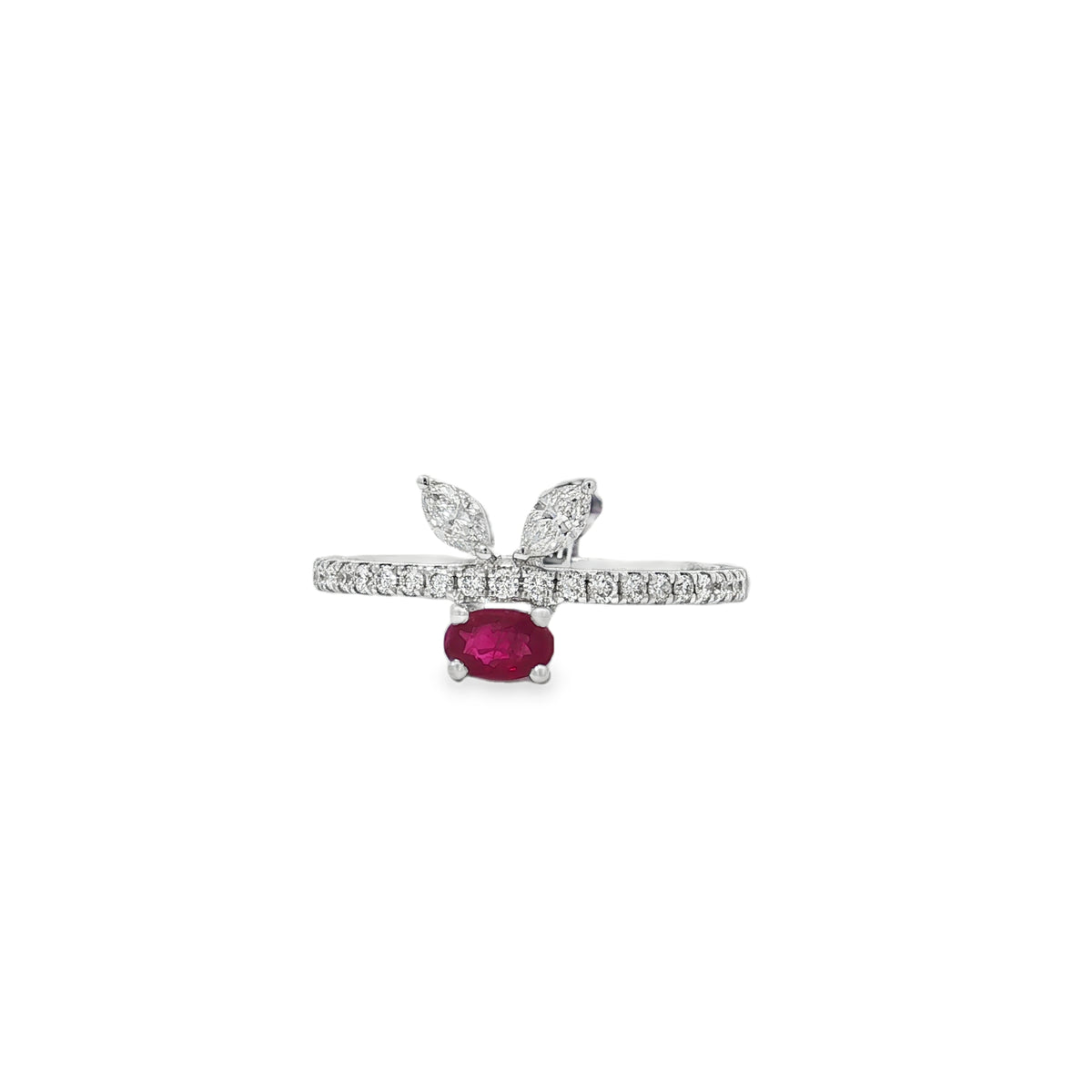 White gold ring with oval ruby beneath two marquise diamond leaves