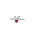 White gold ring with oval ruby beneath two marquise diamond leaves