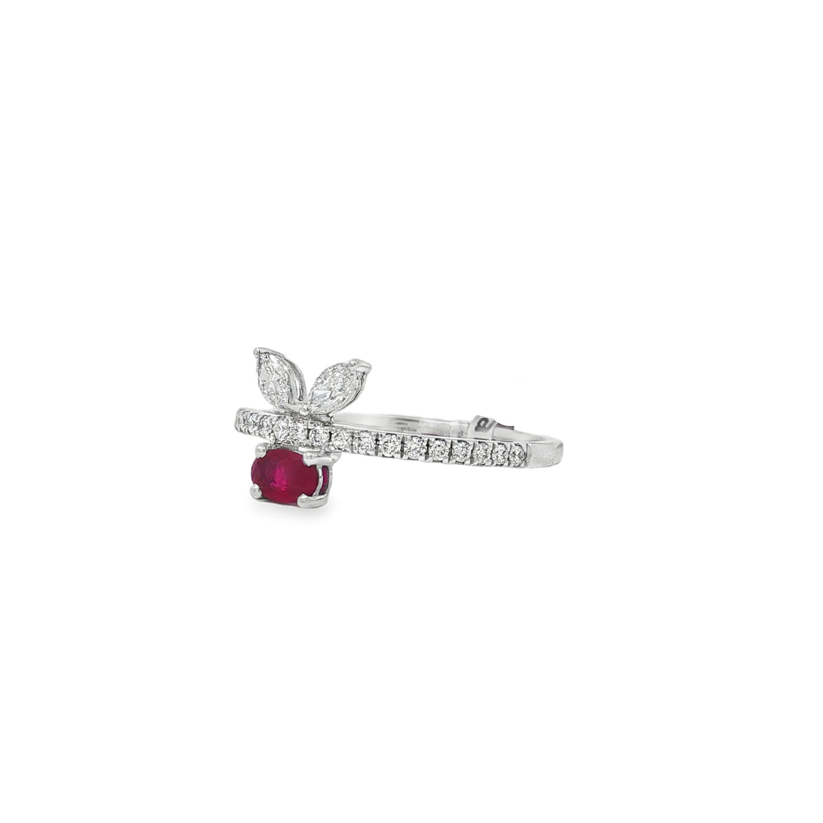 Angled view of oval ruby leaf ring showing the round diamond band and raised settings