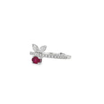 Angled view of oval ruby leaf ring showing the round diamond band and raised settings
