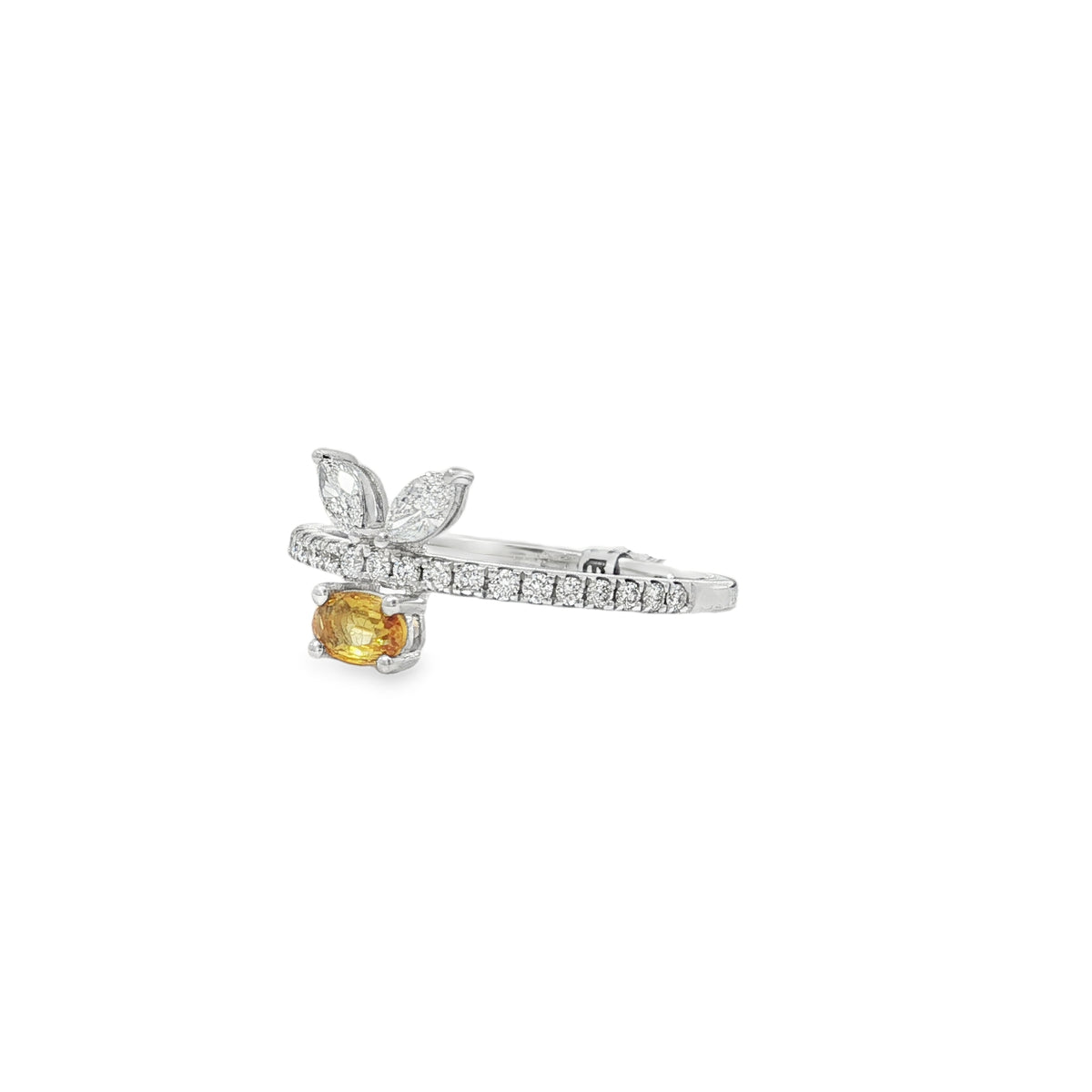 Angled view of yellow sapphire leaf ring showing raised stone settings and diamond band